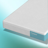 Casper Snow Hybrid Mattress against blue and white background