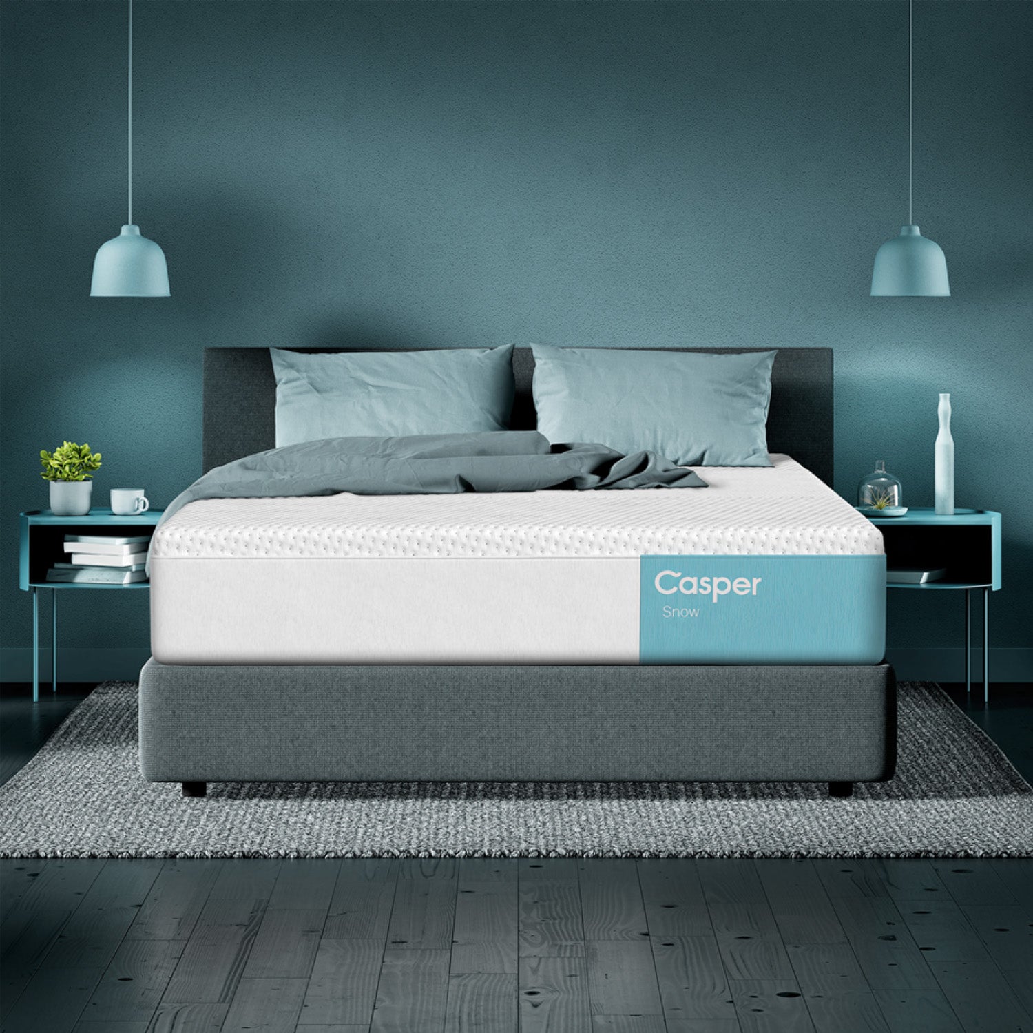 Casper Snow Hybrid Mattress in a modern room with lamps and blue back wall