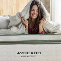 avocado green mattress plush female model covered by comforter
